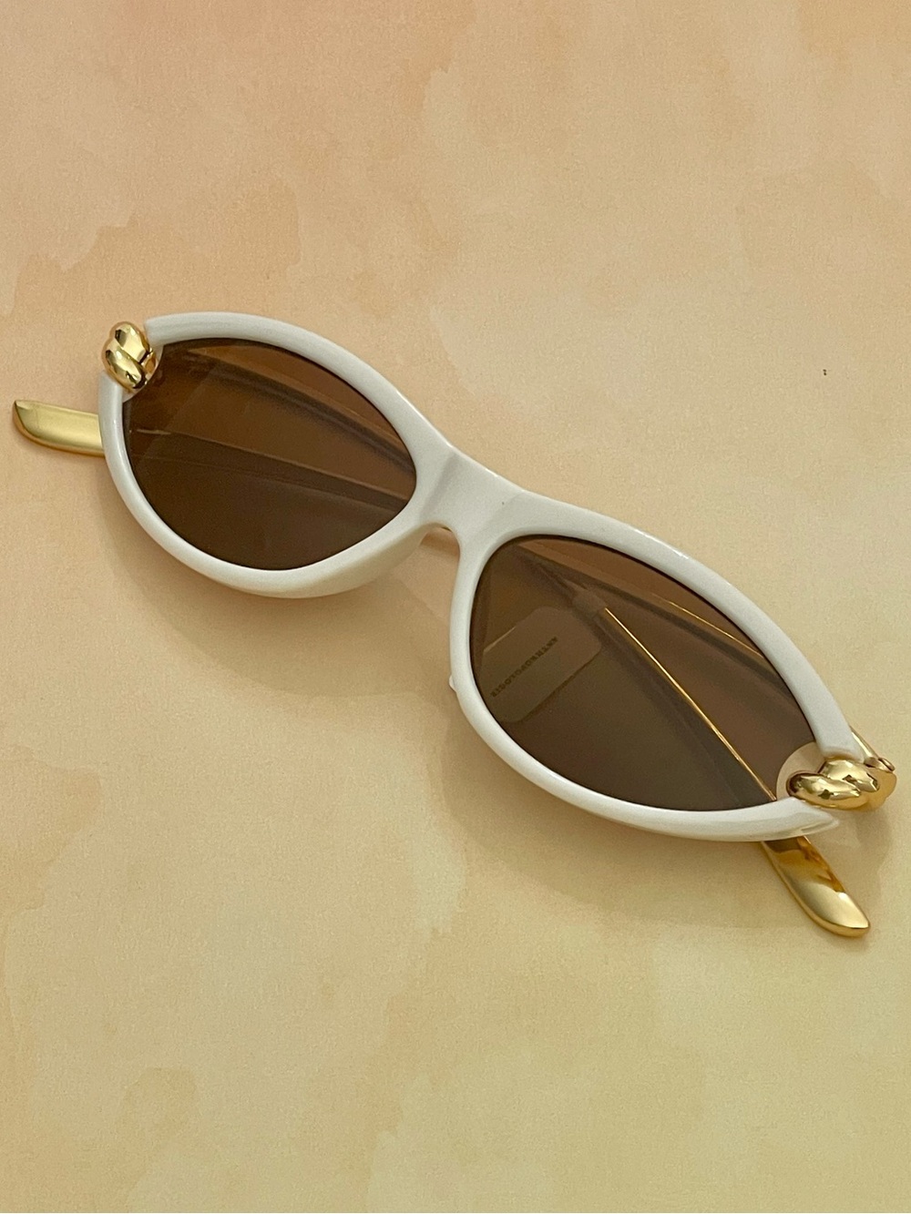 Anthropologie White Slim Oval Cat Eye Sunglasses Gold Metal Knotted Design Arms